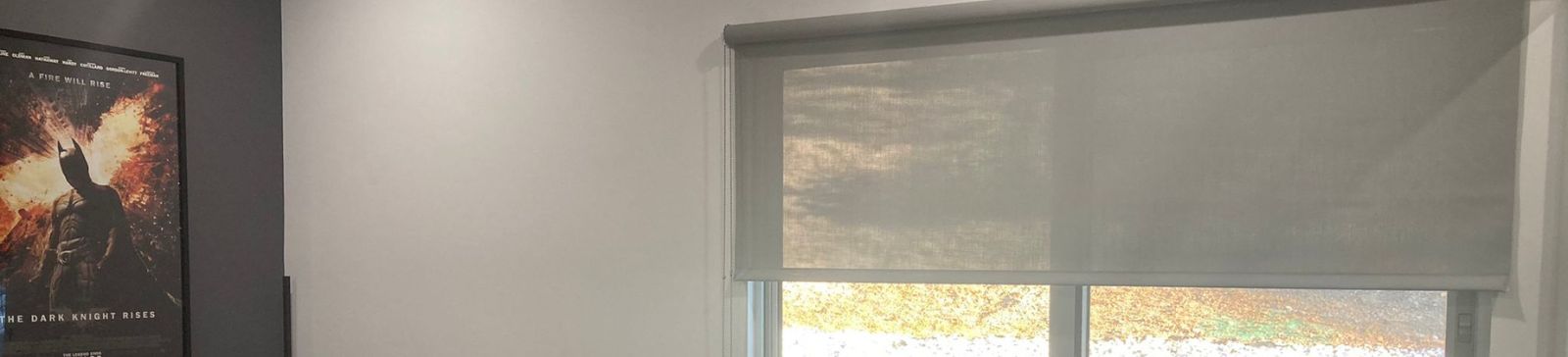 Bright boy’s bedroom in Yorba Linda featuring half-pulled down sheer roller shades for windows, allowing soft daylight.